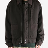 Brown jacket worn by a person, showing the jacket's fit