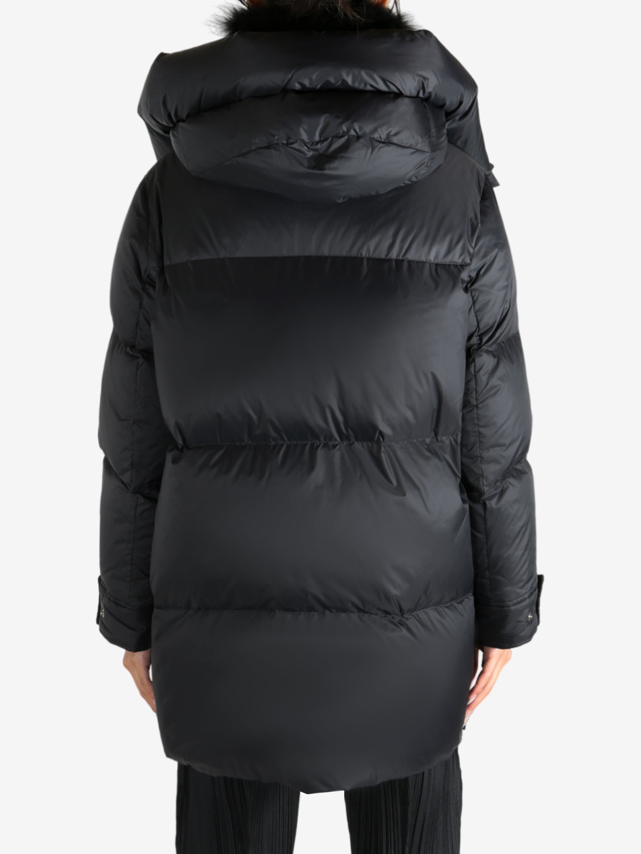 Black jacket worn by a person, showing the jacket's fit