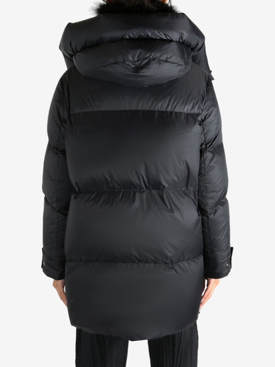 Black jacket worn by a person, showing the jacket's fit