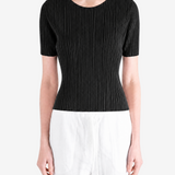 Black shirt worn by a person, showing the shirt fit