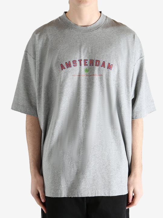 Grey t-shirt worn by a person, showing the t-shirt's fit