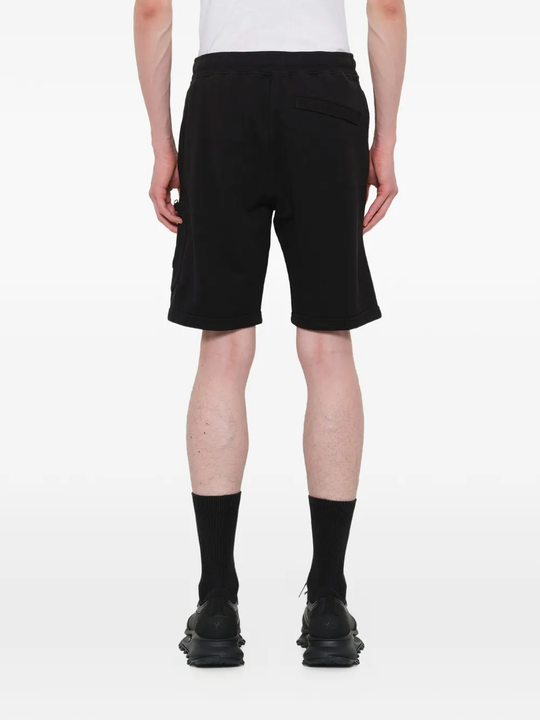 Black shorts warn a person,showing the shorts fit