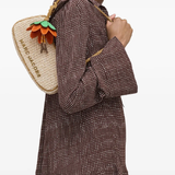 tan bag worn by a person, showing the bag fit