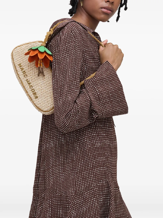 tan bag worn by a person, showing the bag fit