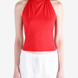 Red top worn by a person, showing the top fit