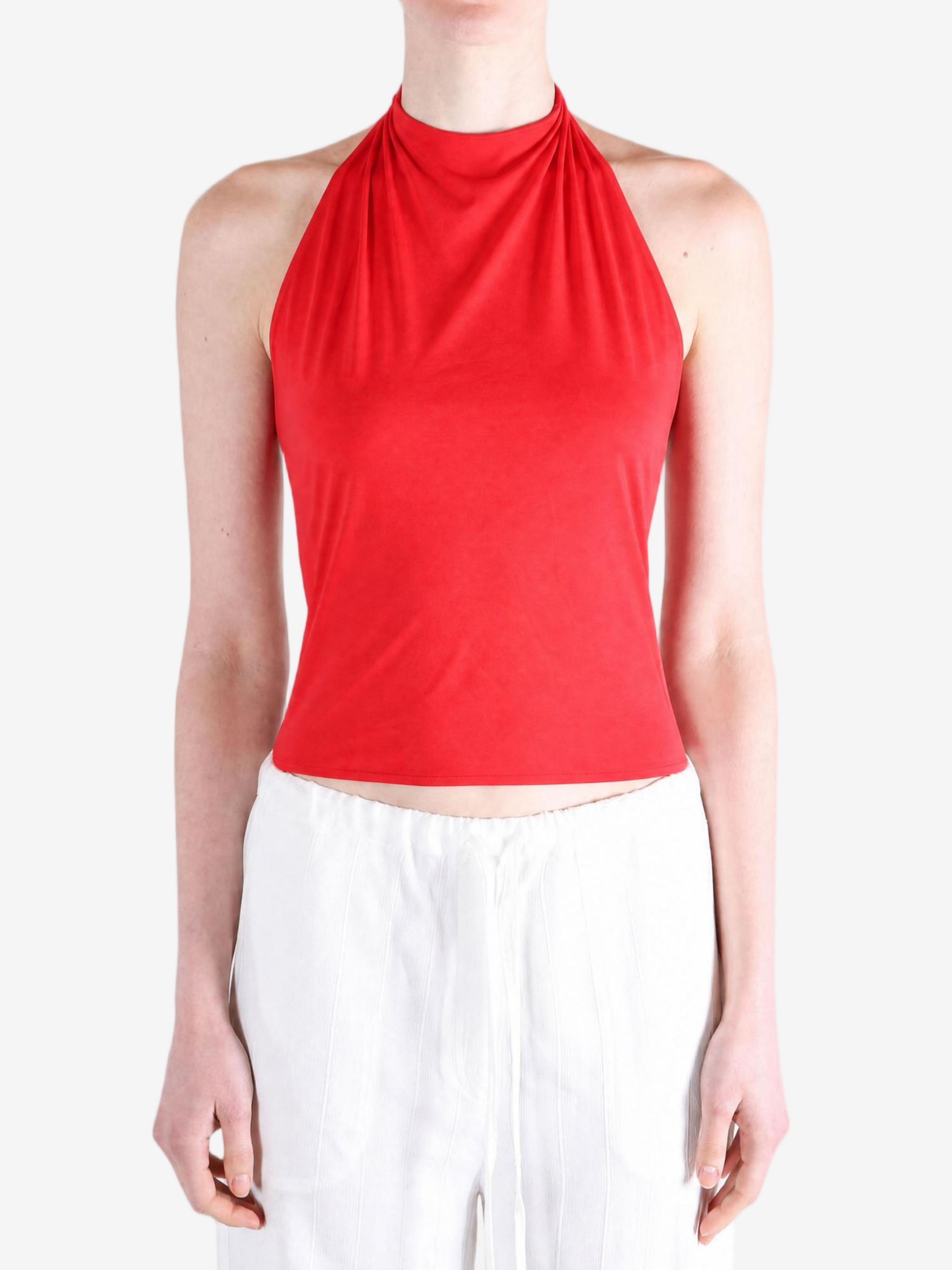 Red top worn by a person, showing the top fit
