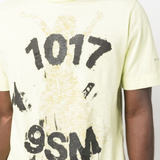 Close up of the Yellow shirt, showing texture of the cotton fabric