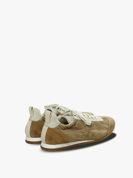 Tan sneakers, side view
