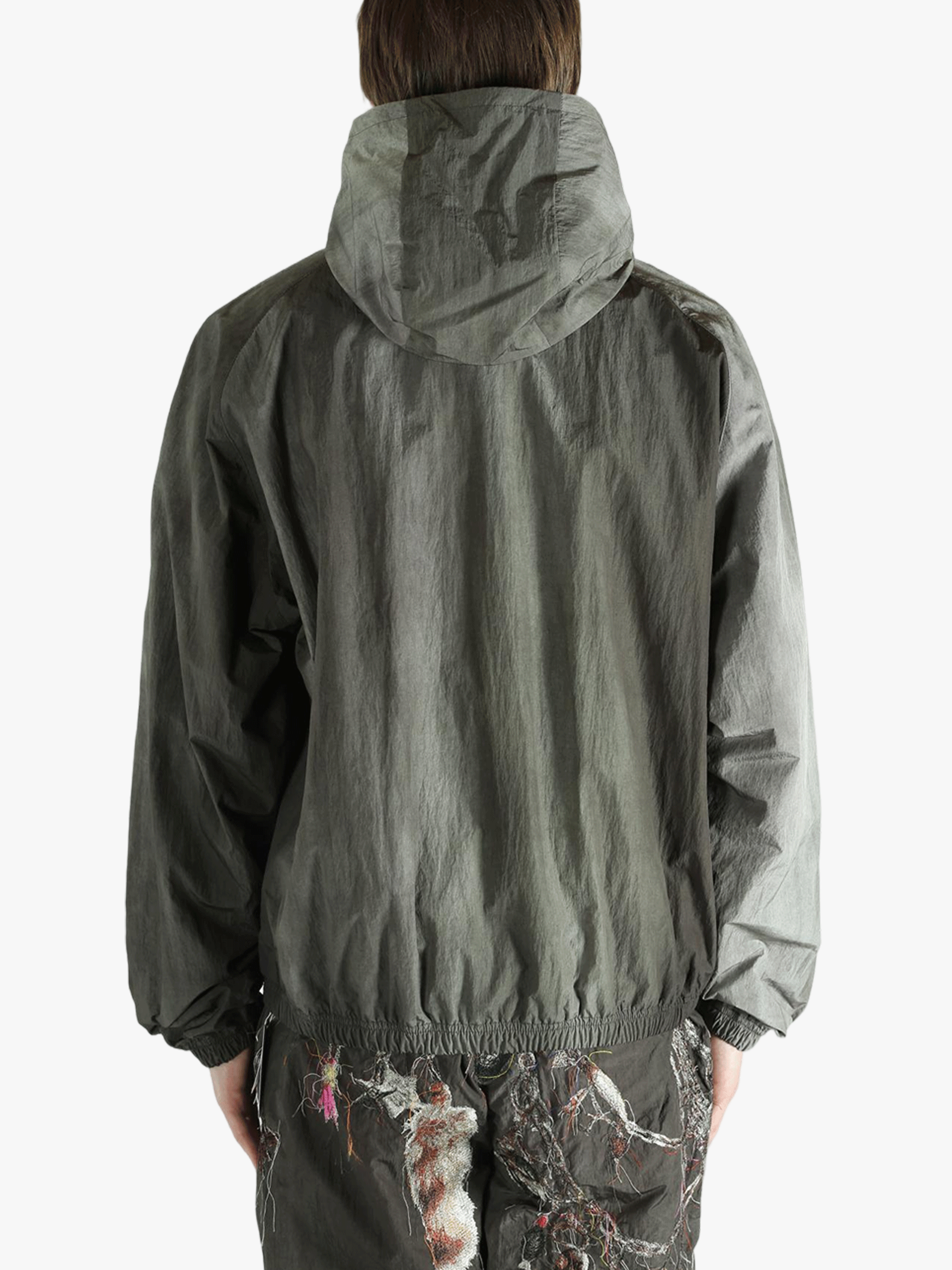 Grey jacket worn by a person, showing the jacket's fit