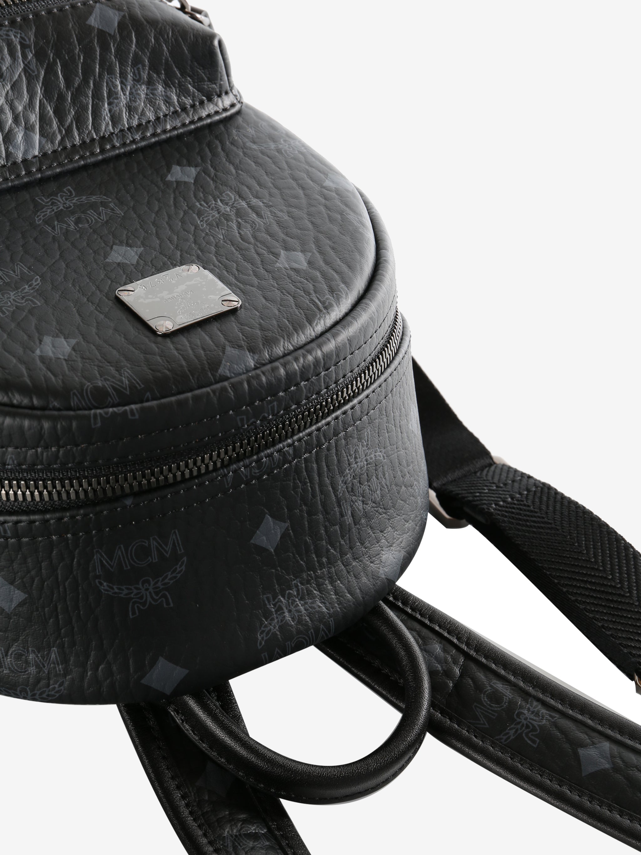 Close up of black backpack,showing texture of the faux nappa fabric