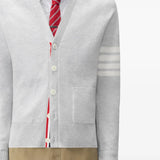 White knitwear worn by a person, showing the knitwear fit