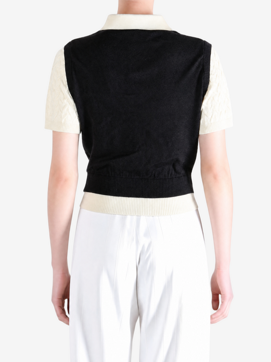 Black shirt worn by a person, showing the shirt fit