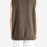 Brown hoodie worn by a person, showing the hoodie fit