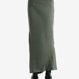 Green skirt worn by a person, showing the skirt fit