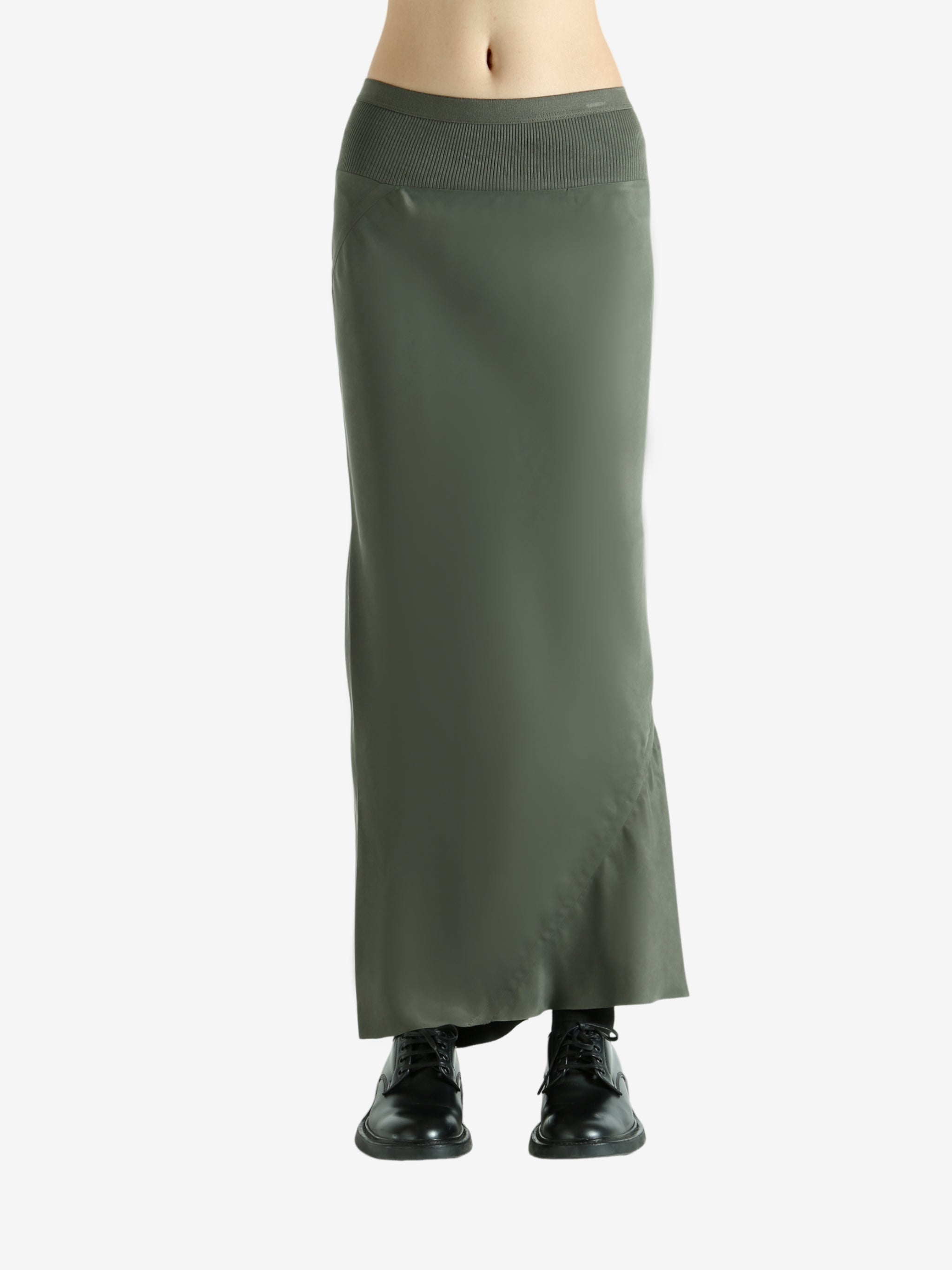 Green skirt worn by a person, showing the skirt fit