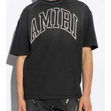 Black t-shirt worn by a person, showing the t-shirt fit