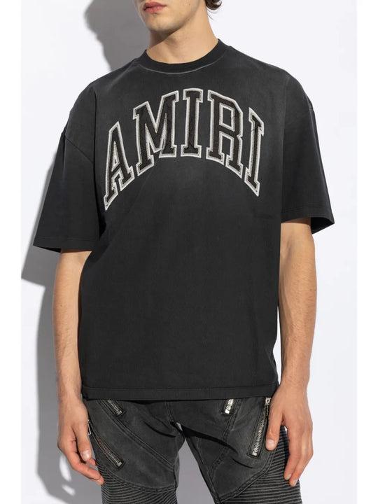 Black t-shirt worn by a person, showing the t-shirt fit