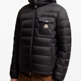 Black jacket worn by a person, showing the jacket fit
