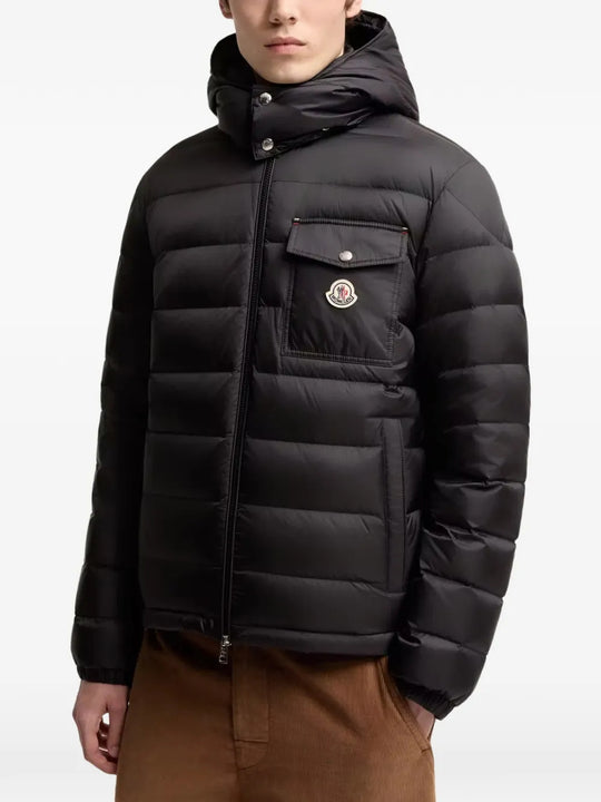 Black jacket worn by a person, showing the jacket fit