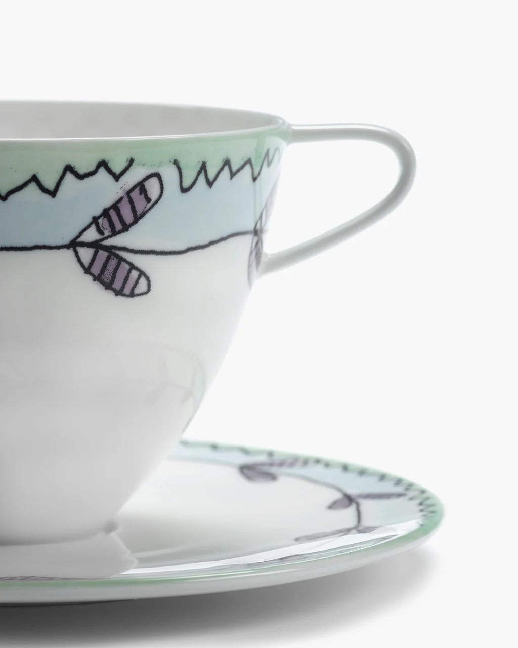 Close up of white cup, showing texture of the bone porcelain fabric