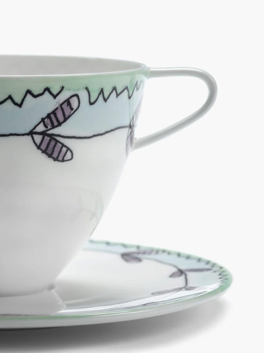 Close up of white cup, showing texture of the bone porcelain fabric