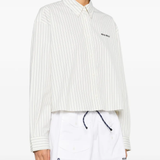 white shirts worn by a person, showing the shirts fit