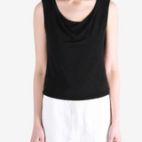 Black top worn by a person, showing the top fit