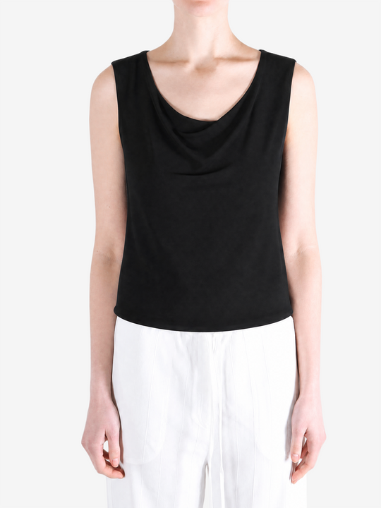 Black top worn by a person, showing the top fit