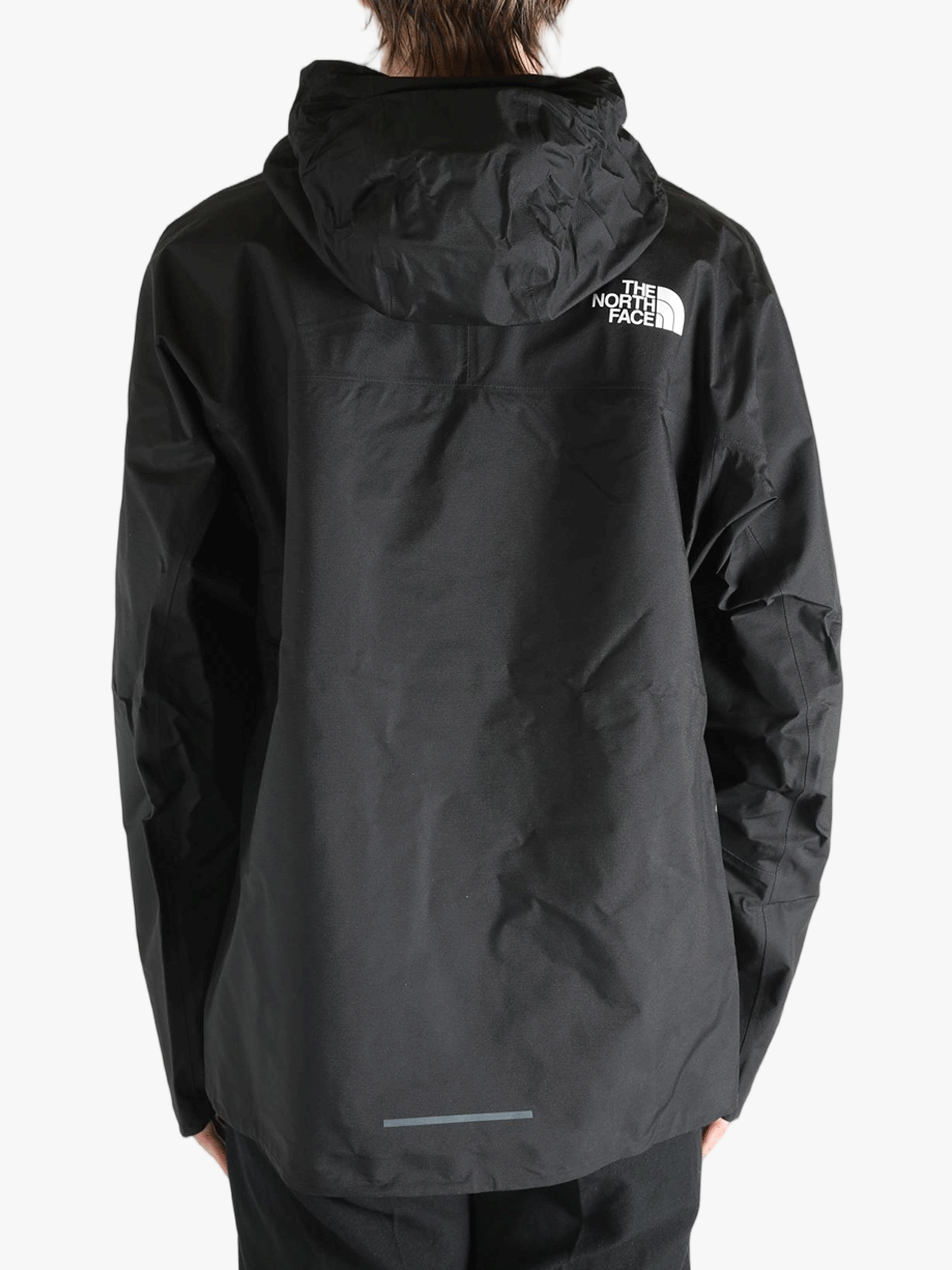 Black jacket worn by a person, showing the jacket's fit