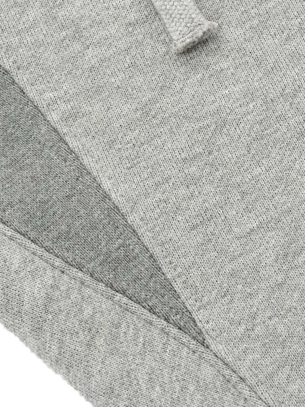 Cloes-up of grey pants, showing texture of the cotton fabric