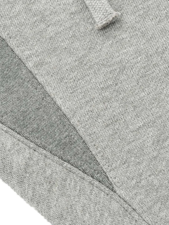 Cloes-up of grey pants, showing texture of the cotton fabric