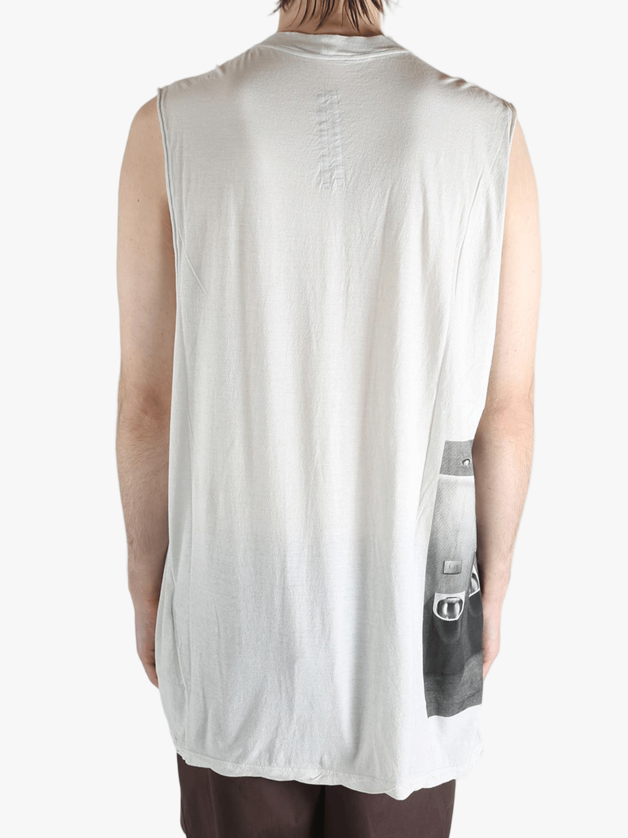 White top worn by a person, showing the top's fit