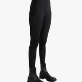 Black pants worn by a person, showing the pants fit