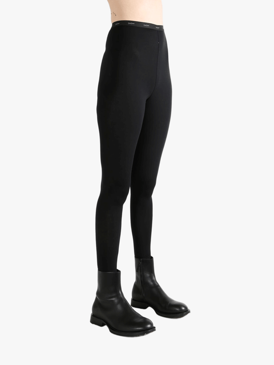 Black pants worn by a person, showing the pants fit