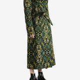 Green coat worn by a person, showing the coat's fit