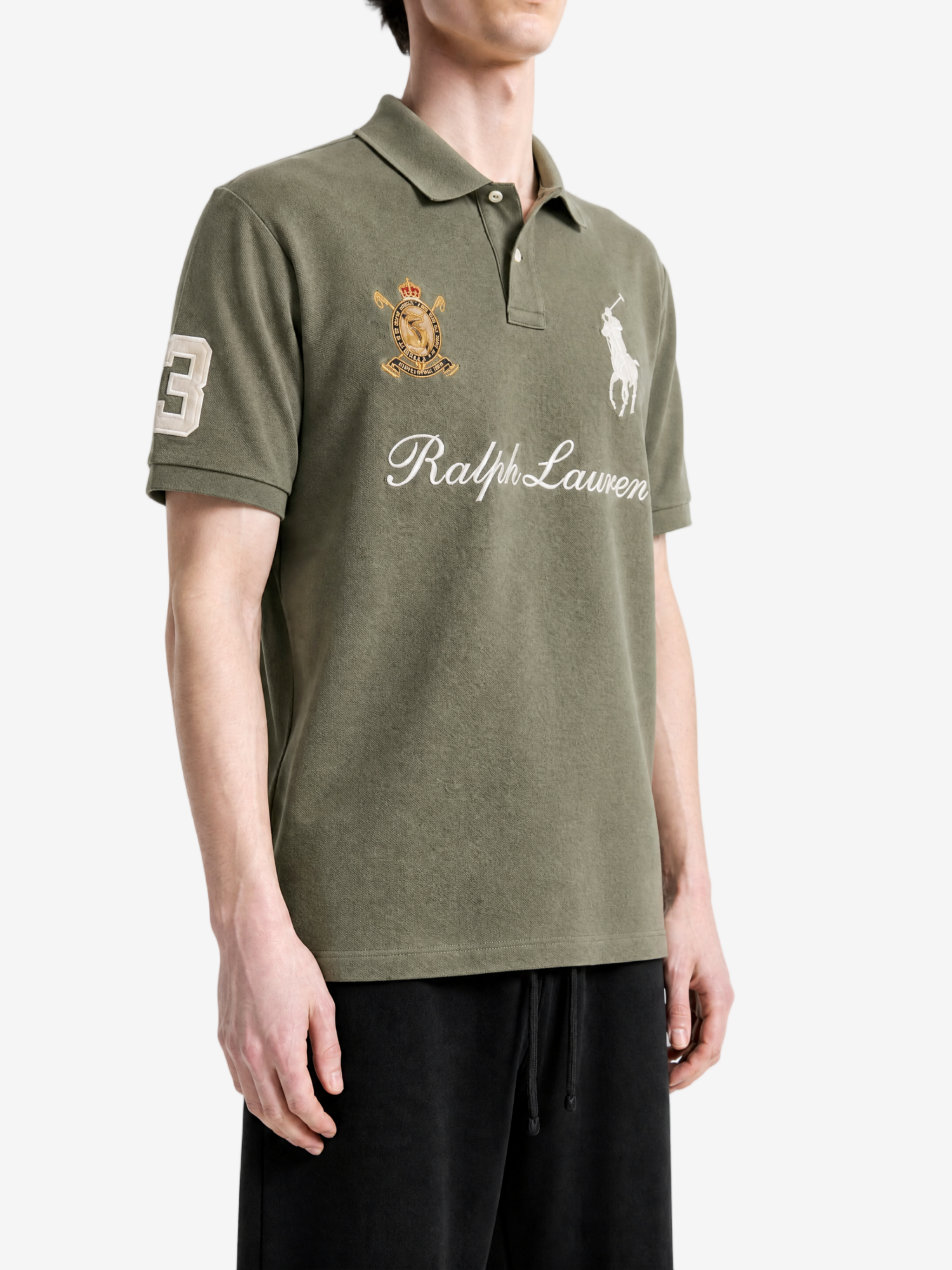 Green shirt worn by a person, showing the shirt fit
