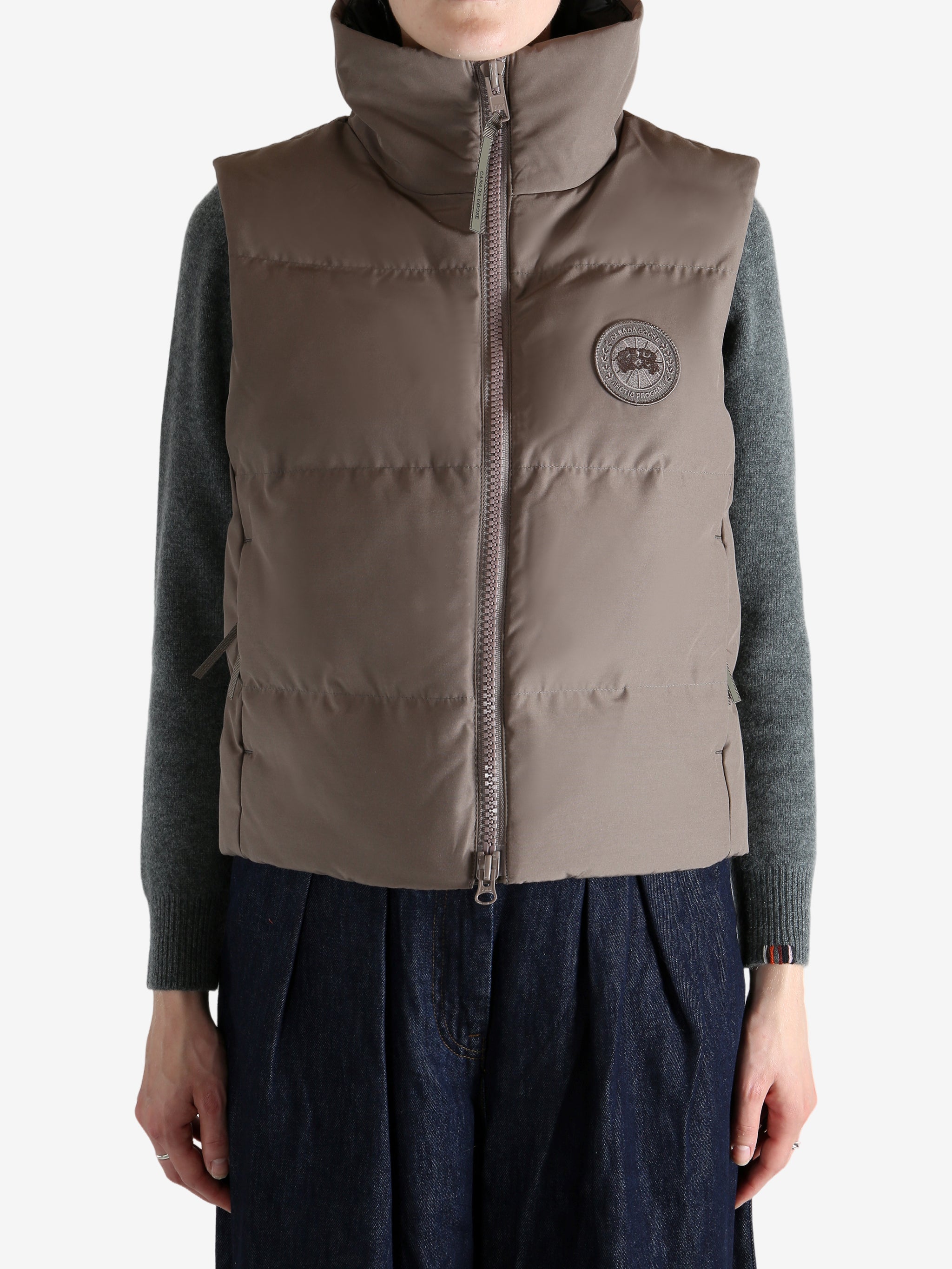 Brown vest worn by a person, showing the vest's fit