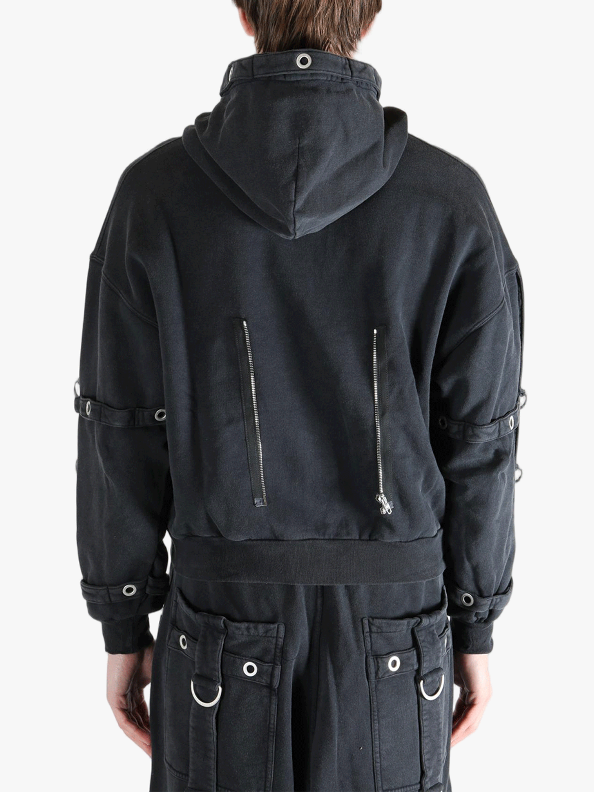 Black jacket worn by a person, showing the jacket's fit