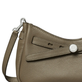 close up of green bags, showing texture of the leather fabric