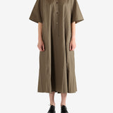 Brown dress worn by a person, showing the dress's fit