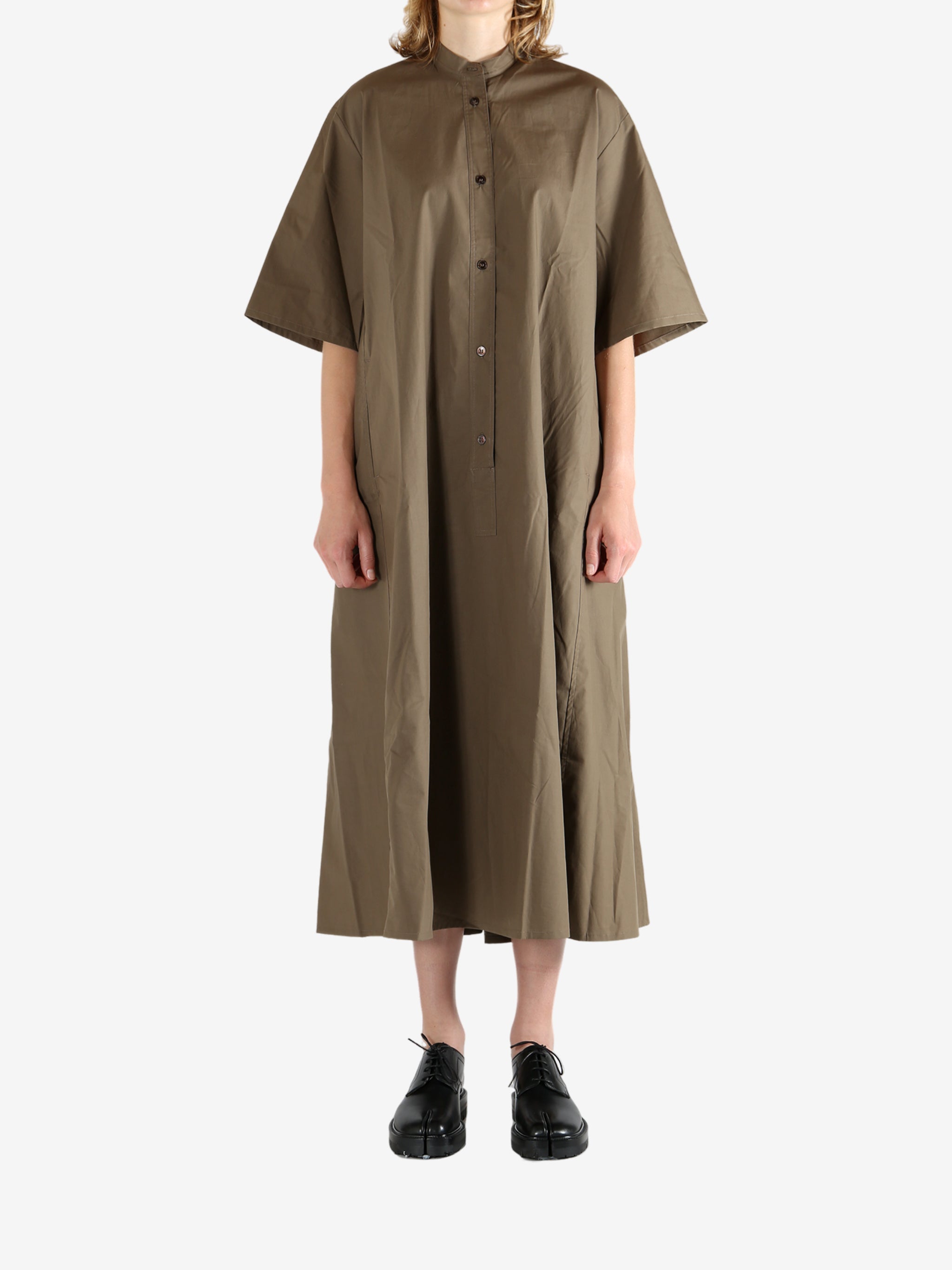 Brown dress worn by a person, showing the dress's fit