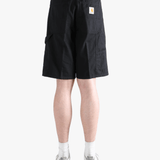 Black shorts worn by a person, showing the shorts fit