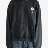 Black hoodie worn by a person, showing the hoodie's fit