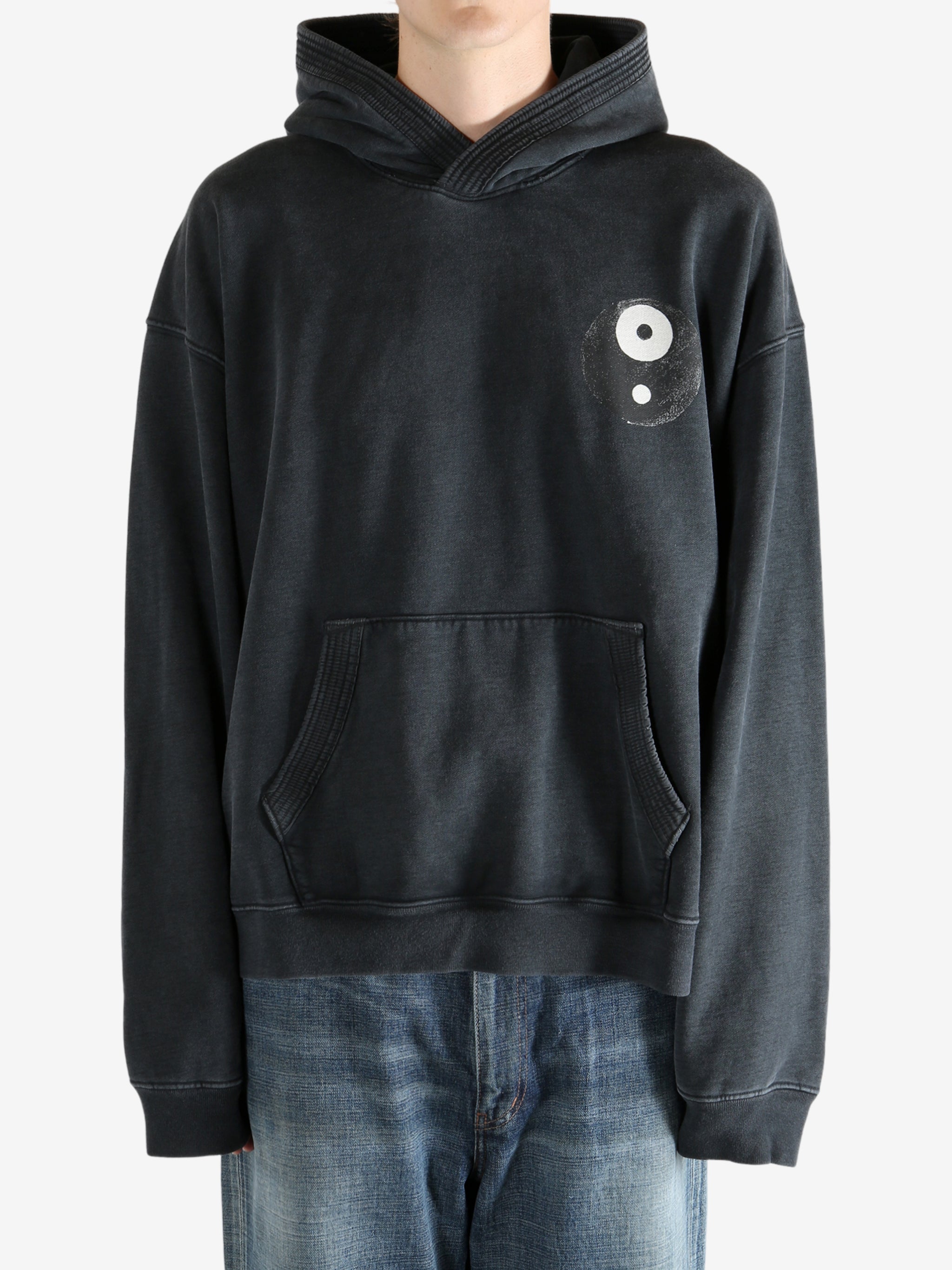 Black hoodie worn by a person, showing the hoodie's fit