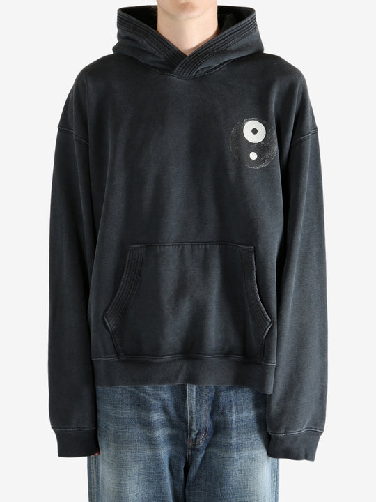 Black hoodie worn by a person, showing the hoodie's fit