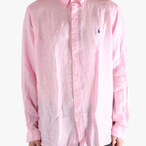 Pink shirt worn by a person, showing the shirt's fit