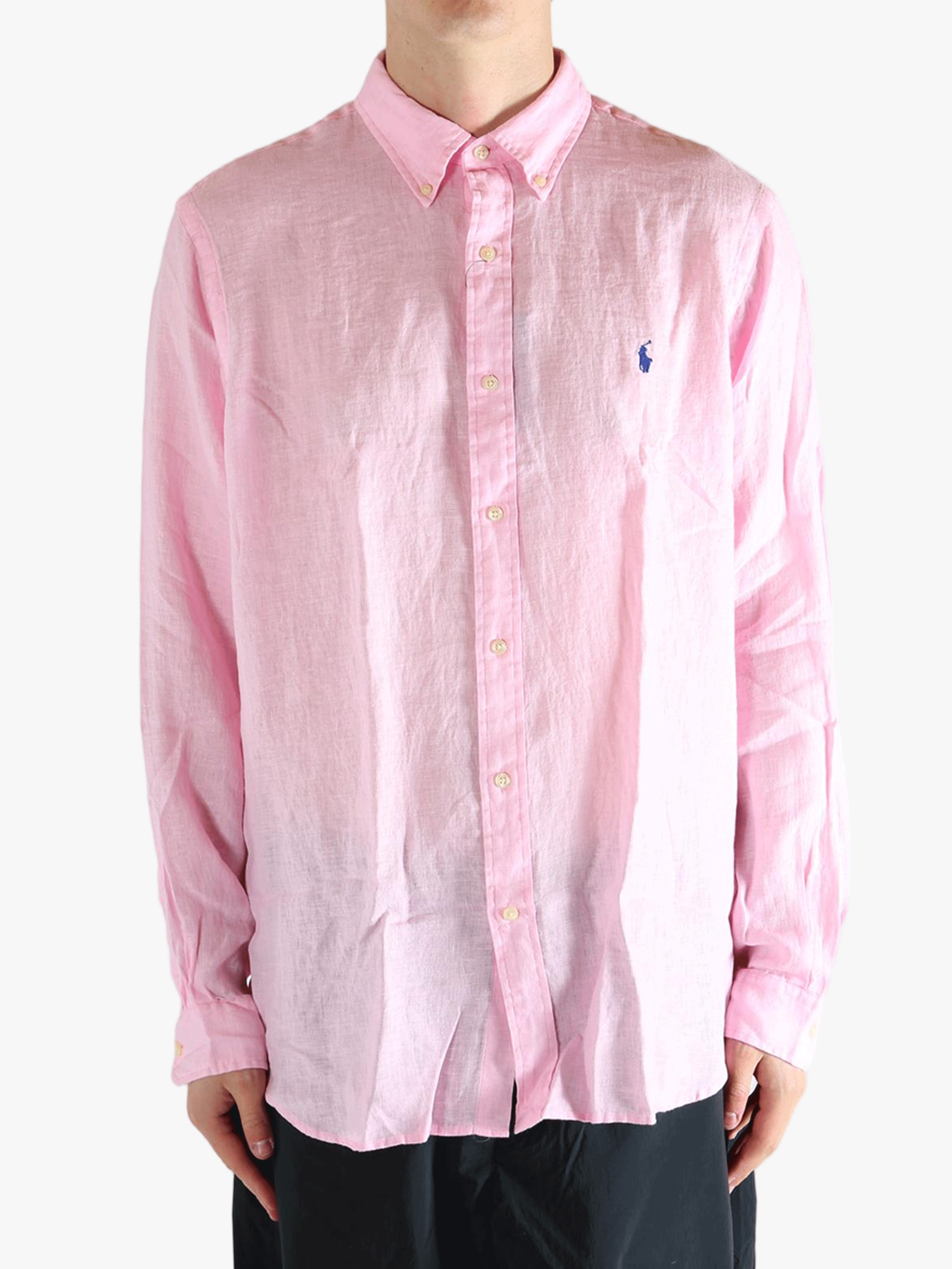 Pink shirt worn by a person, showing the shirt's fit