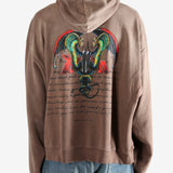 Brown hoodie worn by a person, showing the hoodie's fit