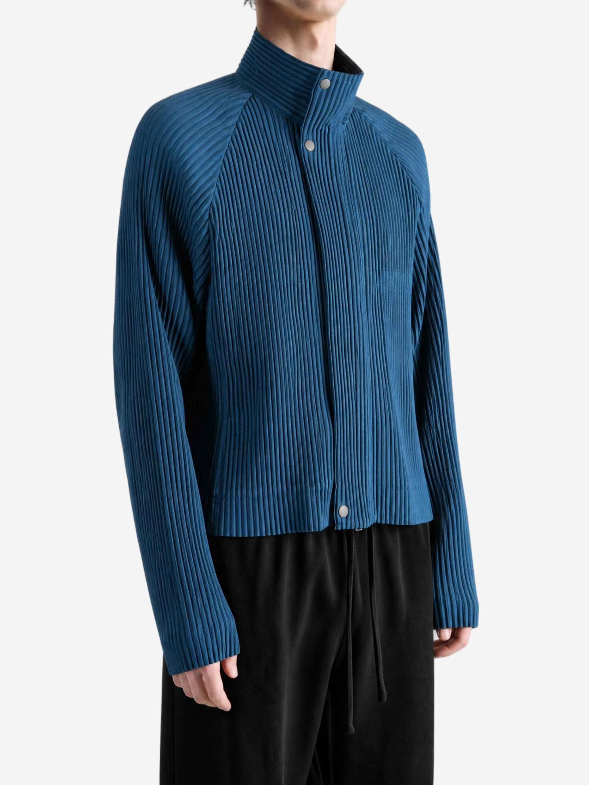 Blue jacket worn by a person, showing the jacket fit