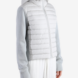 White hoodie worn by a person, showing the hoodie fit